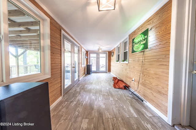 656 Hinton Hills Loop, Hardinsburg, KY 40143 - hallway with french doors, wood walls, and hardwood / wood-style flooring