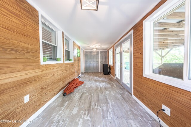 656 Hinton Hills Loop, Hardinsburg, KY 40143 - hallway featuring wood walls, wood finished floors, and french doors