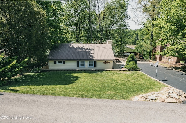 656 Hinton Hills Loop, Hardinsburg, KY 40143 - view of front of home with a chimney, metal roof, a front yard, and driveway