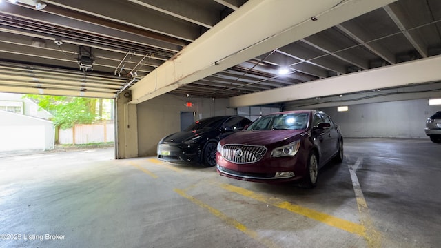 parking deck featuring a garage door opener and electric panel