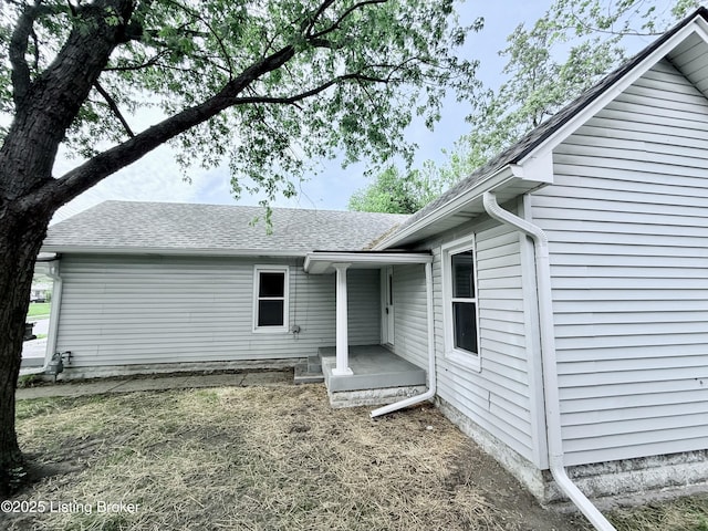 713 E Hill St, Louisville, KY 40217 - rear view of property featuring roof with shingles