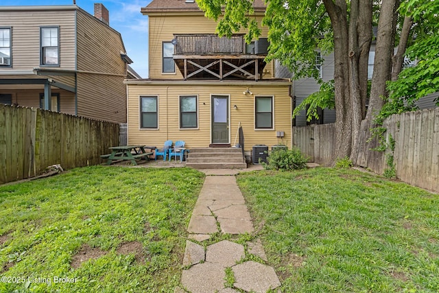 1210 E Broadway, Louisville, KY 40204 - rear view of property featuring entry steps, a balcony, and central AC