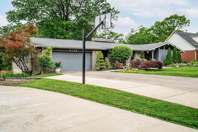 9100 Lakeridge Dr, Louisville, KY 40272 - view of front of property with concrete driveway, a garage, a front yard, and brick siding
