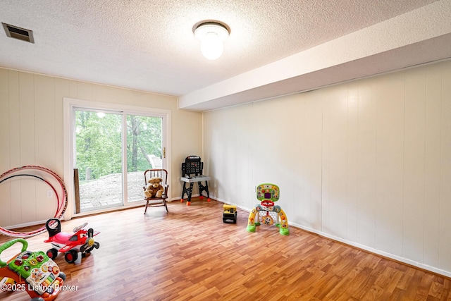 9100 Lakeridge Dr, Louisville, KY 40272 - playroom with wood finished floors and a textured ceiling
