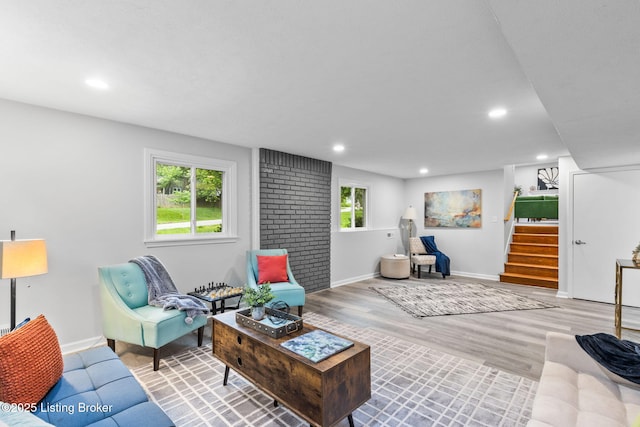 living room with stairway, baseboards, wood finished floors, and recessed lighting