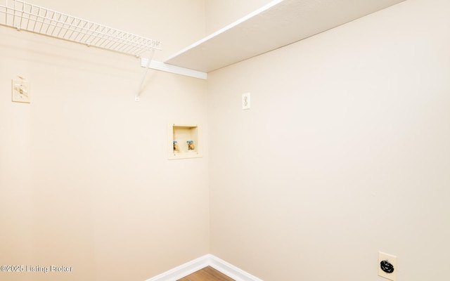 laundry area with electric dryer hookup, hookup for a washing machine, baseboards, and wood finished floors