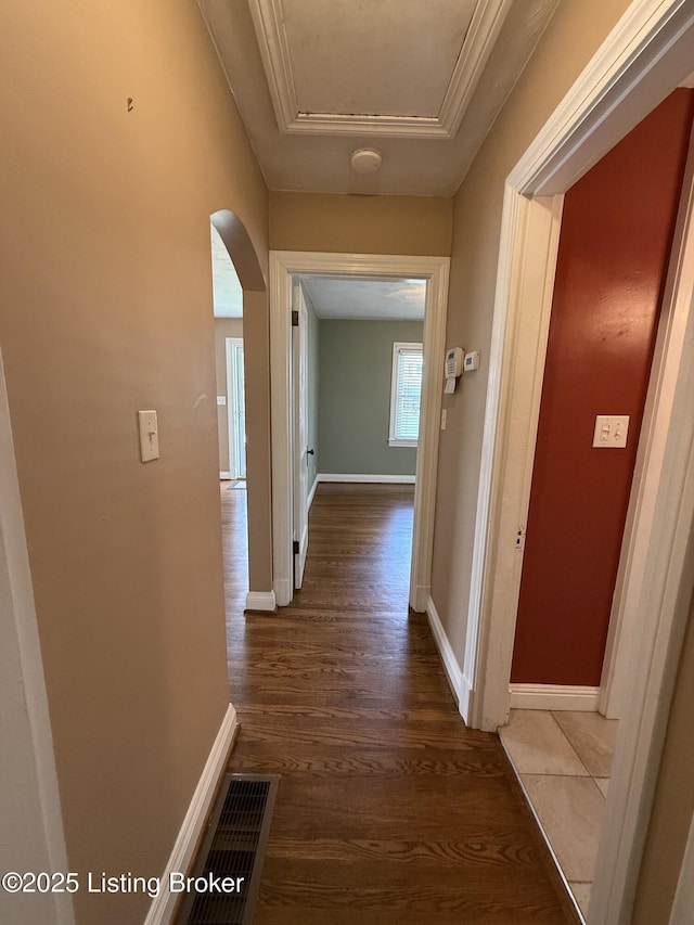 612 Ervay Ave, Louisville, KY 40217 - hall featuring arched walkways, wood finished floors, and baseboards