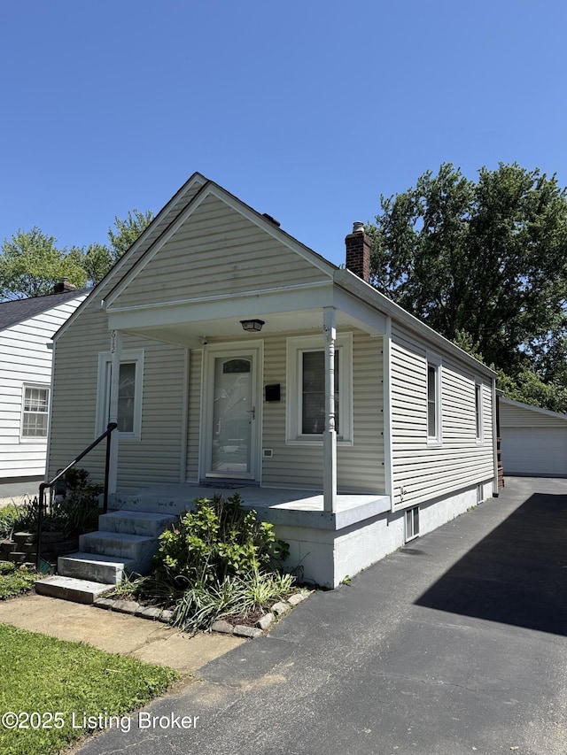 612 Ervay Ave, Louisville, KY 40217 - view of front of home featuring a porch and a chimney
