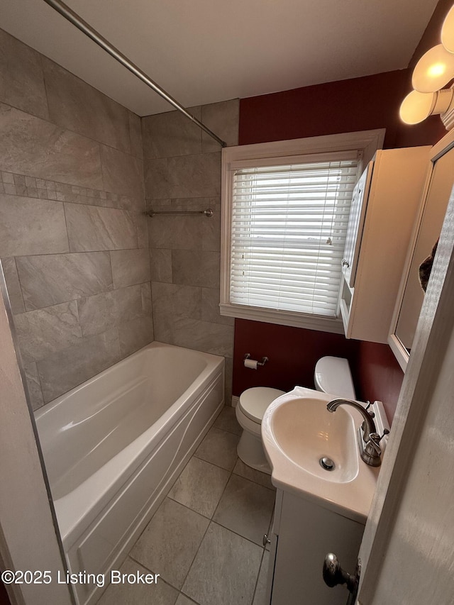 612 Ervay Ave, Louisville, KY 40217 - bathroom featuring toilet, vanity, shower / washtub combination, and tile patterned floors