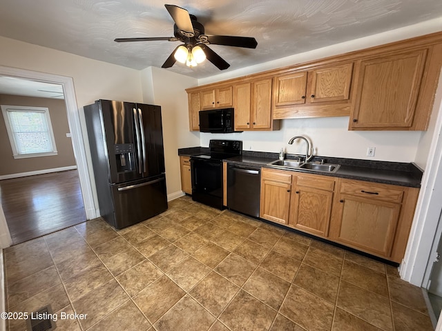 612 Ervay Ave, Louisville, KY 40217 - kitchen featuring black appliances, a sink, dark countertops, a ceiling fan, and baseboards