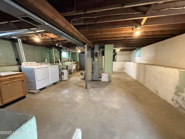 612 Ervay Ave, Louisville, KY 40217 - unfinished basement featuring washer and dryer, a sink, and heating unit