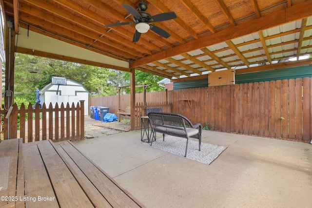3745 Rosemont Blvd, Louisville, KY 40218 - view of patio / terrace with ceiling fan, a fenced backyard, an outdoor structure, and a shed