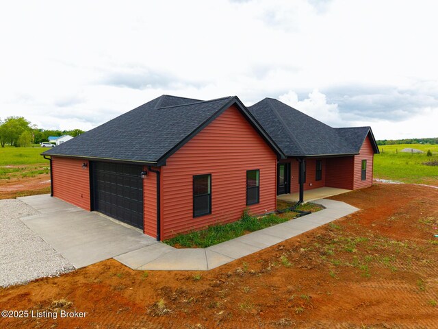 view of front of house with roof with shingles
