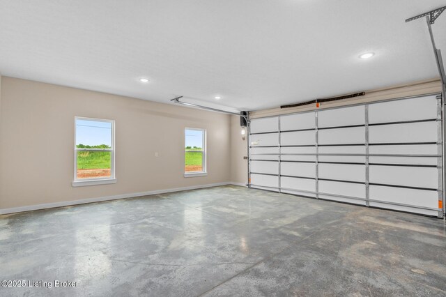 garage featuring baseboards and recessed lighting
