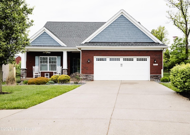 8812 Sanctuary Ln, Louisville, KY 40291 - craftsman inspired home with covered porch, a front lawn, a garage, concrete driveway, and roof with shingles