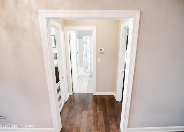 8812 Sanctuary Ln, Louisville, KY 40291 - hall with dark wood-style flooring and baseboards