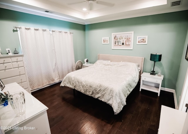 8812 Sanctuary Ln, Louisville, KY 40291 - bedroom with a raised ceiling and dark wood-style flooring
