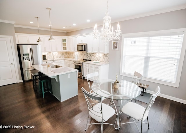 8812 Sanctuary Ln, Louisville, KY 40291 - kitchen featuring stainless steel appliances, a sink, decorative backsplash, glass insert cabinets, and a breakfast bar