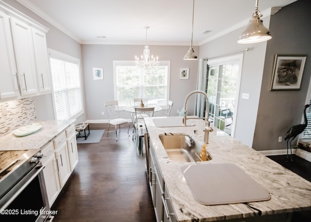8812 Sanctuary Ln, Louisville, KY 40291 - kitchen with a sink, an island with sink, dark wood finished floors, stainless steel range with electric cooktop, and decorative backsplash