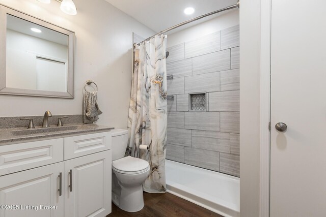 7208 Ridge Creek Rd, Louisville, KY 40291 - bathroom featuring toilet, vanity, a shower with shower curtain, wood finished floors, and recessed lighting