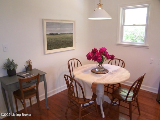 132 Goodloe Ave, Bloomfield, KY 40008 - dining room with baseboards and dark wood-type flooring