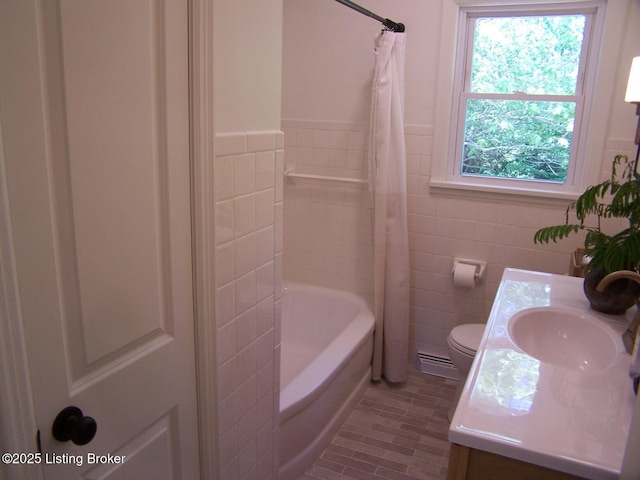 132 Goodloe Ave, Bloomfield, KY 40008 - full bath with tile walls, toilet, vanity, baseboard heating, and a wainscoted wall