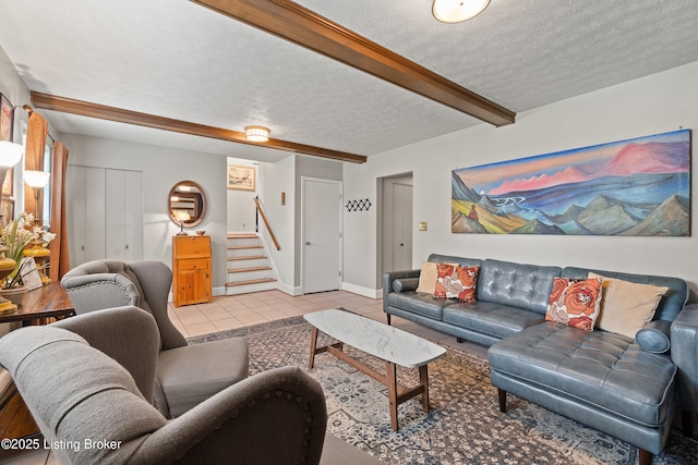 2512 Hounz Ln, Louisville, KY 40223 - living room featuring stairway, beamed ceiling, light tile patterned flooring, a textured ceiling, and baseboards