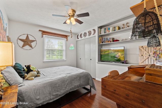 2512 Hounz Ln, Louisville, KY 40223 - bedroom with dark wood finished floors, a closet, a ceiling fan, and a textured ceiling