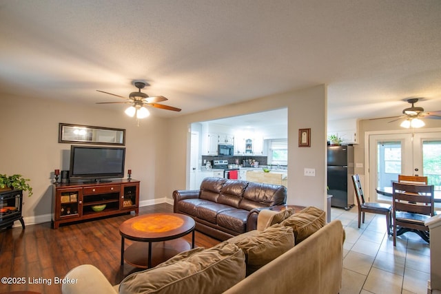395 Poplar Trce, Elizabethtown, KY 42701 - living area featuring a ceiling fan, baseboards, plenty of natural light, and a wood stove