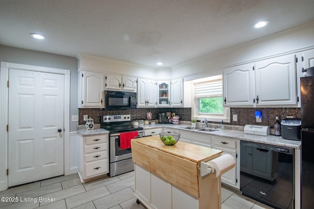 395 Poplar Trce, Elizabethtown, KY 42701 - kitchen featuring black appliances, a sink, white cabinetry, backsplash, and a kitchen island