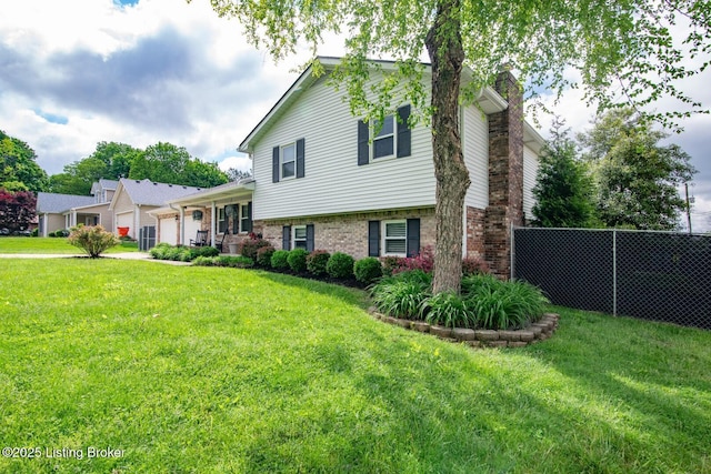 395 Poplar Trce, Elizabethtown, KY 42701 - tri-level home featuring an attached garage, brick siding, and a chimney