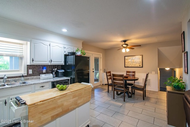 395 Poplar Trce, Elizabethtown, KY 42701 - kitchen featuring freestanding refrigerator, butcher block countertops, a sink, white cabinets, and a ceiling fan