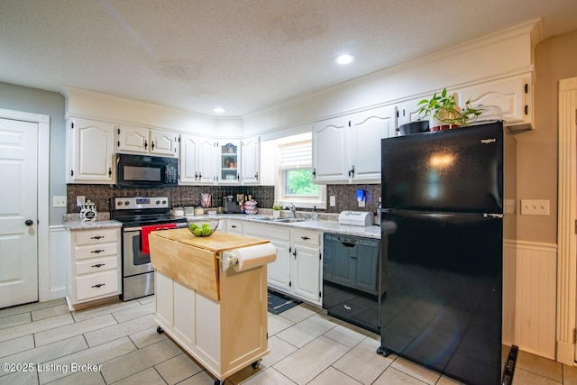 395 Poplar Trce, Elizabethtown, KY 42701 - kitchen with black appliances, white cabinets, decorative backsplash, wainscoting, and recessed lighting