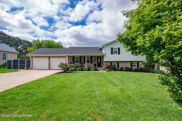395 Poplar Trce, Elizabethtown, KY 42701 - tri-level home featuring a garage, driveway, and brick siding