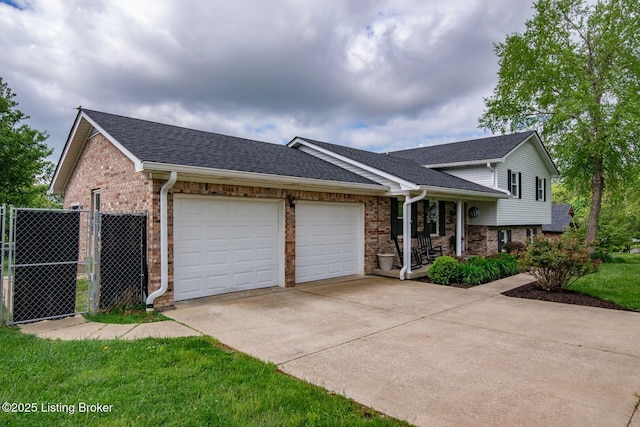 395 Poplar Trce, Elizabethtown, KY 42701 - split level home featuring brick siding, an attached garage, driveway, and roof with shingles