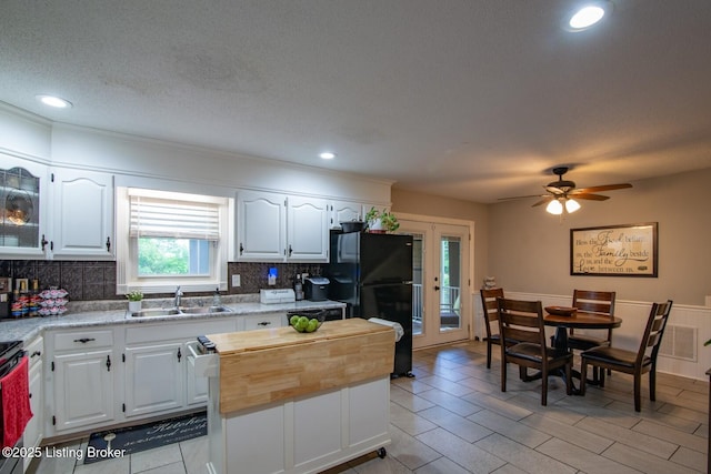 395 Poplar Trce, Elizabethtown, KY 42701 - kitchen with a sink, freestanding refrigerator, tasteful backsplash, white cabinets, and recessed lighting