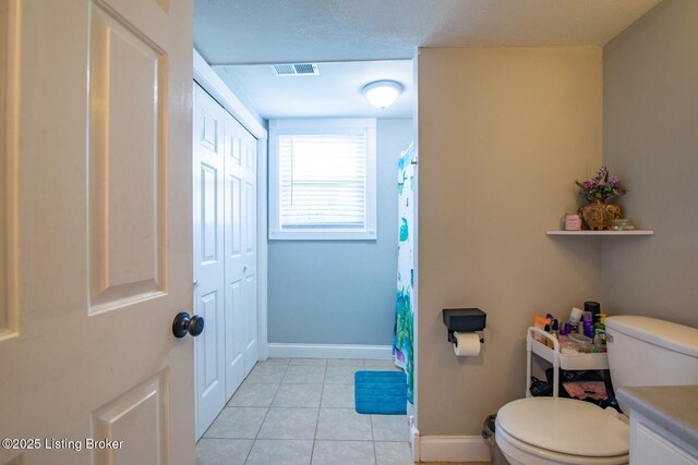 395 Poplar Trce, Elizabethtown, KY 42701 - full bathroom featuring toilet, tile patterned flooring, baseboards, and a shower with shower curtain
