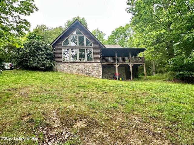 2212 Duff Rd, Leitchfield, KY 42754 - back of house featuring log siding, a wooden deck, a lawn, and stone siding