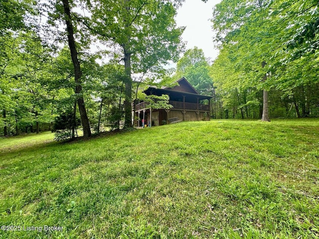 2212 Duff Rd, Leitchfield, KY 42754 - view of grassy yard featuring a wooden deck and a forest view