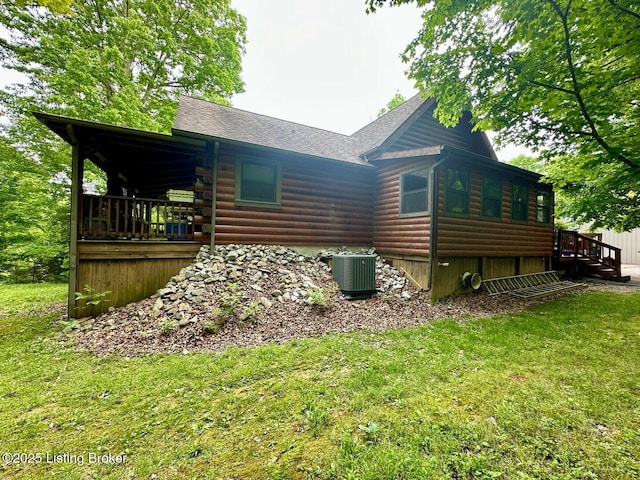 2212 Duff Rd, Leitchfield, KY 42754 - rear view of house with central AC, a yard, roof with shingles, and log exterior