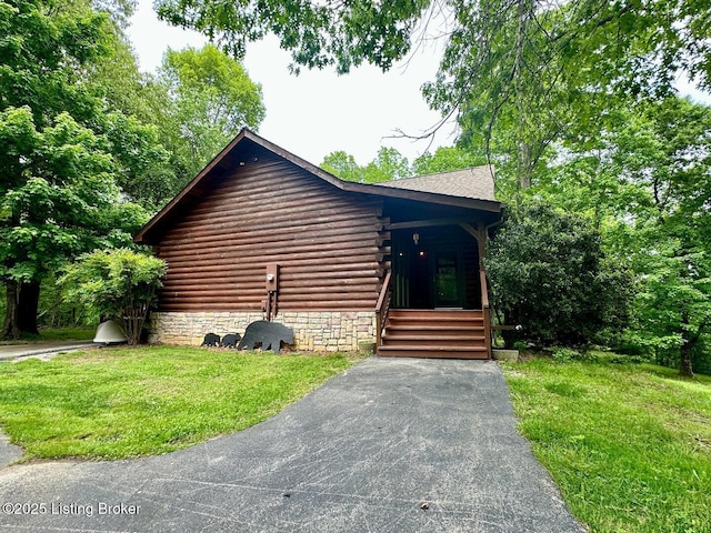2212 Duff Rd, Leitchfield, KY 42754 - view of property exterior with log siding and a yard
