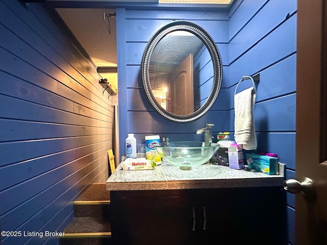 2212 Duff Rd, Leitchfield, KY 42754 - bathroom featuring wood walls and vanity