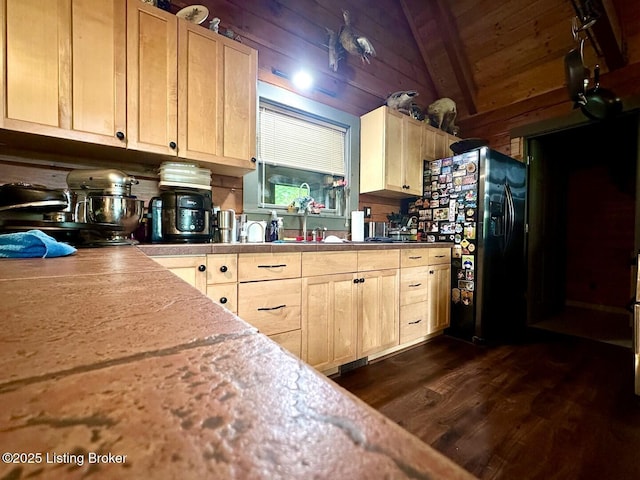 2212 Duff Rd, Leitchfield, KY 42754 - kitchen featuring black fridge with ice dispenser, light brown cabinets, dark wood-style floors, wood walls, and wooden ceiling