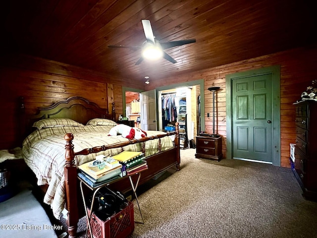 2212 Duff Rd, Leitchfield, KY 42754 - carpeted bedroom with wood ceiling, wooden walls, a walk in closet, a closet, and ceiling fan