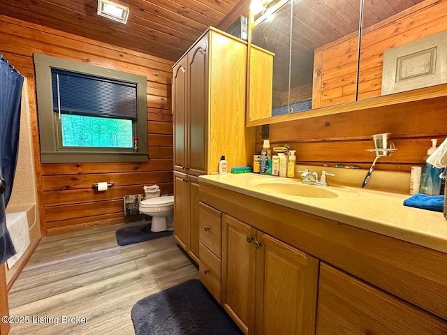 2212 Duff Rd, Leitchfield, KY 42754 - full bathroom featuring wood ceiling, vanity, wood walls, toilet, and wood finished floors