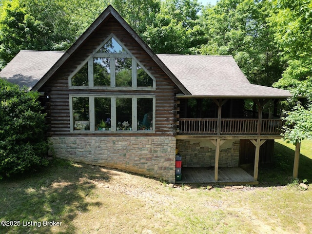 2212 Duff Rd, Leitchfield, KY 42754 - rear view of house with log exterior, stone siding, a yard, a deck, and roof with shingles