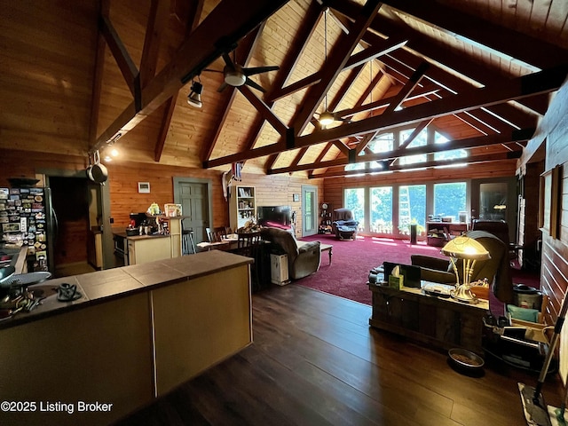 2212 Duff Rd, Leitchfield, KY 42754 - living room featuring wooden walls, dark wood-style floors, beam ceiling, ceiling fan, and high vaulted ceiling
