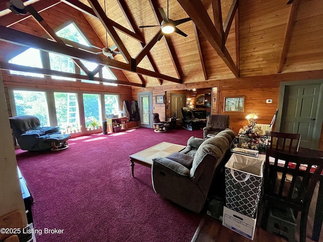 2212 Duff Rd, Leitchfield, KY 42754 - carpeted living room with high vaulted ceiling, wood walls, a ceiling fan, and wooden ceiling with exposed beams