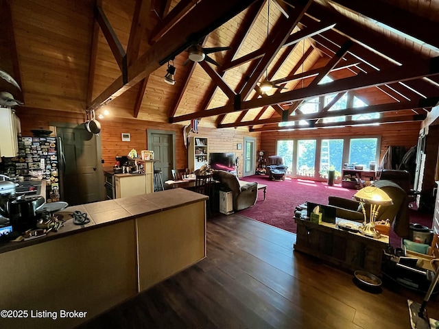 2212 Duff Rd, Leitchfield, KY 42754 - living area featuring wooden walls, dark wood finished floors, high vaulted ceiling, and wooden ceiling with exposed beams