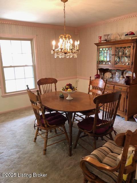 8907 Lakeridge Dr, Louisville, KY 40272 - dining space with a chandelier and baseboards